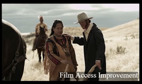 A screenshot from the Whitman Mission orientation film; a person in historic indigenous dress interacts with a person in historic pioneer dress