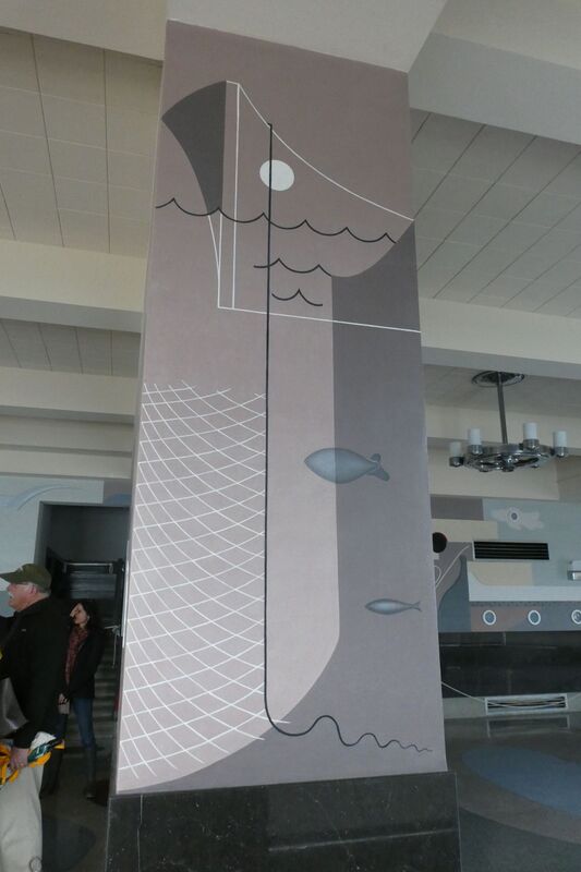 A mural along a beam inside the Aquatic Park Bathhouse, depicting a ship, fishing line and net, and fish