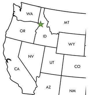 Map of the western United States with a green star marking the location of Nez Perce NHP near the intersection of Washington, Oregon, and Idaho.