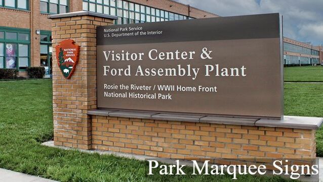 A large sign with the National Park Service logo and the words 