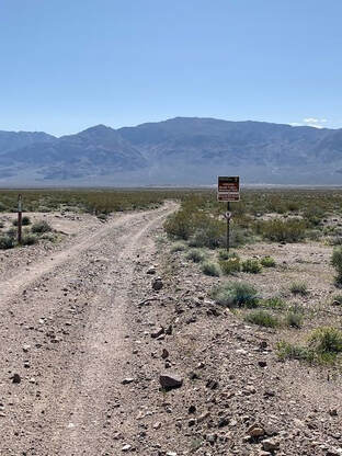 A set of signs marking a backcountry entrance into Death Valley