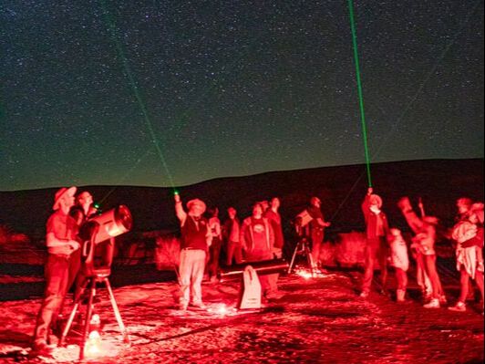 Rangers use laser pointers and telescopes with visitors at the annual Dark Sky Festival