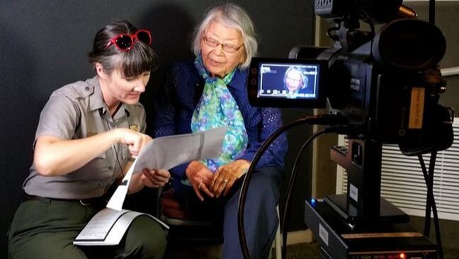 A ranger interviews a former incarceree of Manzanar