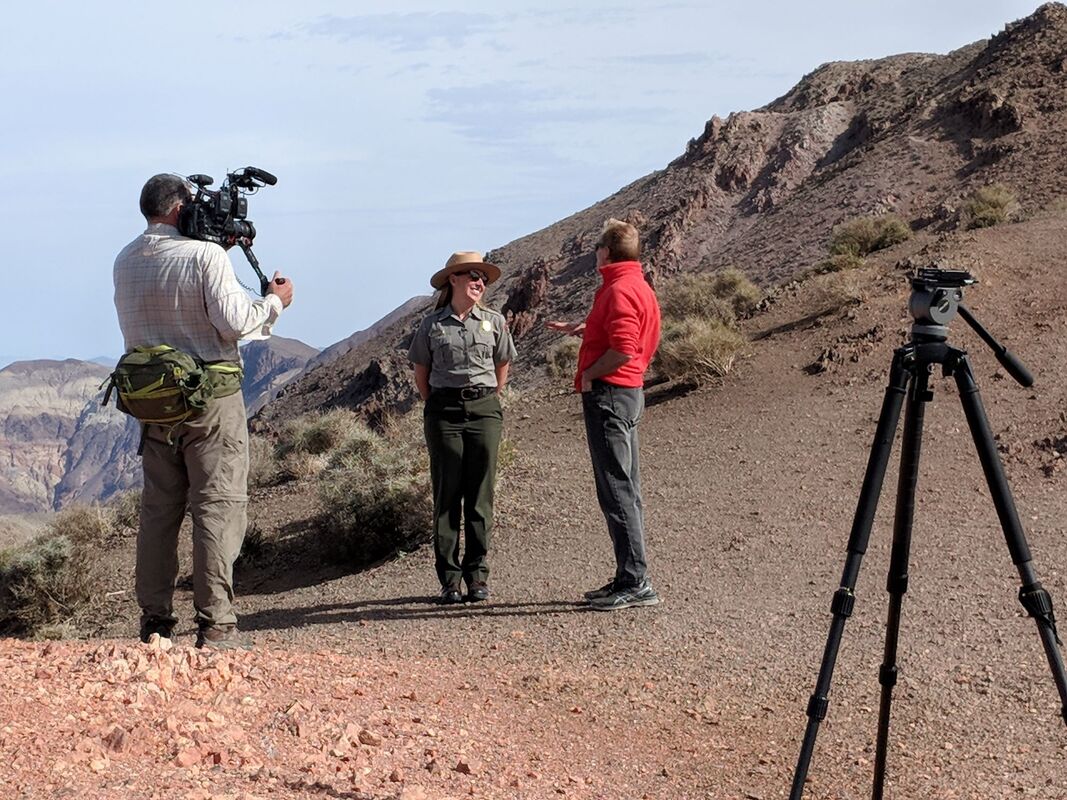 The OpenRoad team interviews a ranger on camera at Dantes View