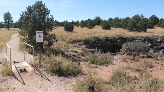 A short dirt trail leads an opening to a lava cave