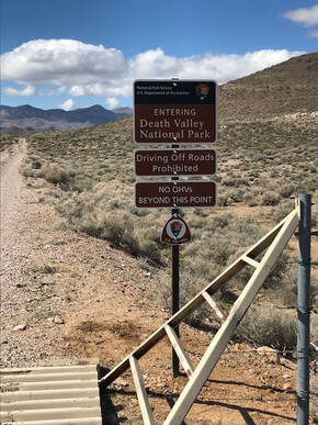 A set of signs marking a backcountry entrance into Death Valley