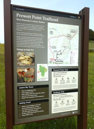 A trailhead sign with the title 
